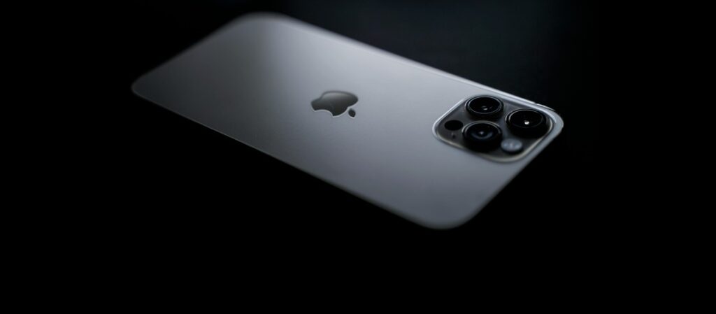 iPhone 16 Pro Max in a dark black background