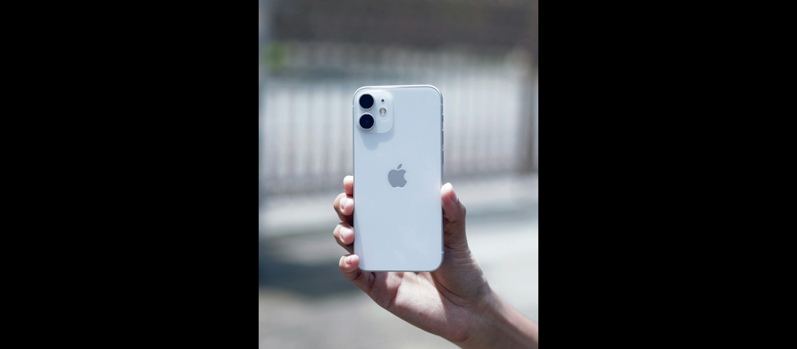 iPhone 12 in hand